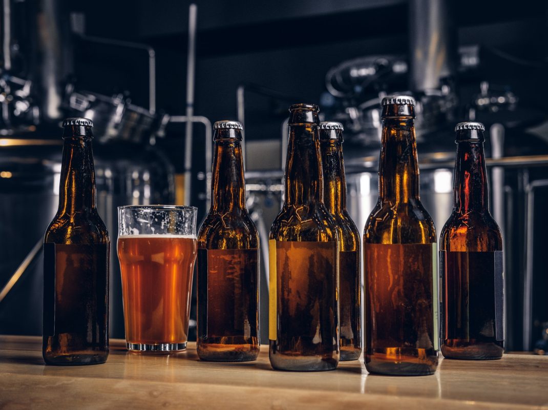 bottles-and-glass-of-craft-beer-on-wooden-bar-counter-at-the-indie-brewery-.jpg bottles-and-glass-of-craft-beer-on-wooden-bar-counter-at-the-indie-brewery-.jpg